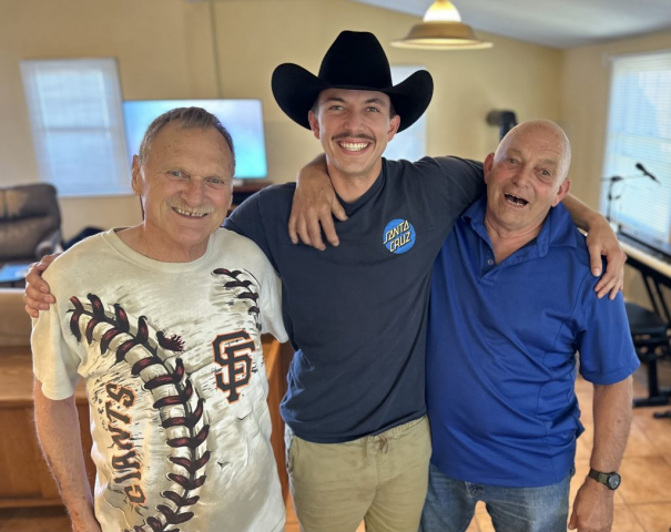 Laren, his grand son Wyatt, and friend Dennis (Wyatt's other grandpa). Laren with his grand son who's wearing a mustache and cowboy hat, with Dennis.