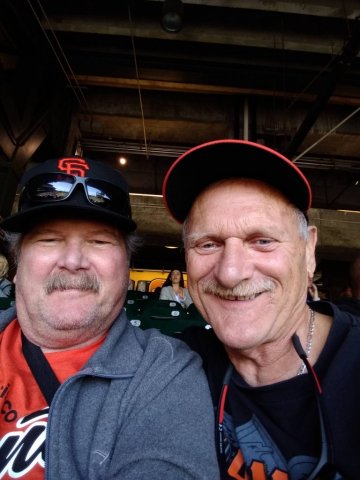 At a SF Giants game with his kid brother Maurice. Photo with his brother.