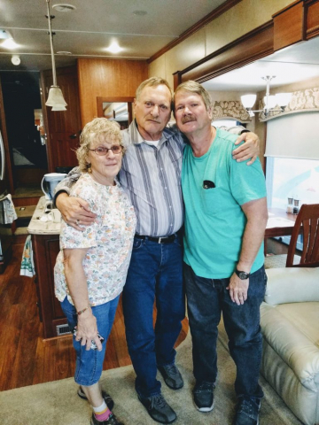 A touching photo of Laren and his little brother Maurice who passed away back in 2021 and his wife Kathy. Laren with his arms around his brother and sister-in-law.