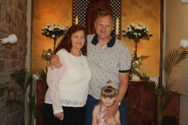 Wife Beverley, Laren, and granddaughter Rheanna in church. Family photo in church.
